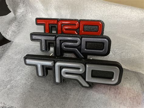 TRD Grille Decor Badge, Tri-Color Grille Badge Emblem Decoration Accessories Car Truck Label Fit for Tacoma 4Runner Tundra Sequoia Rav4 Highlander (Red) 4. . Trd grill badge